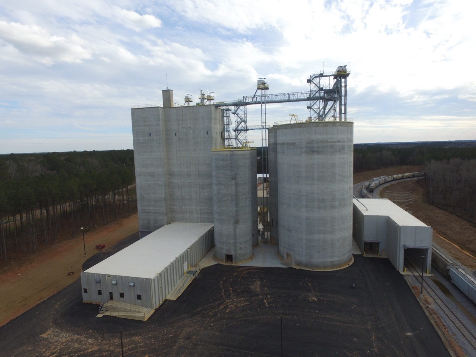 Industrial silos and surrounding landscape