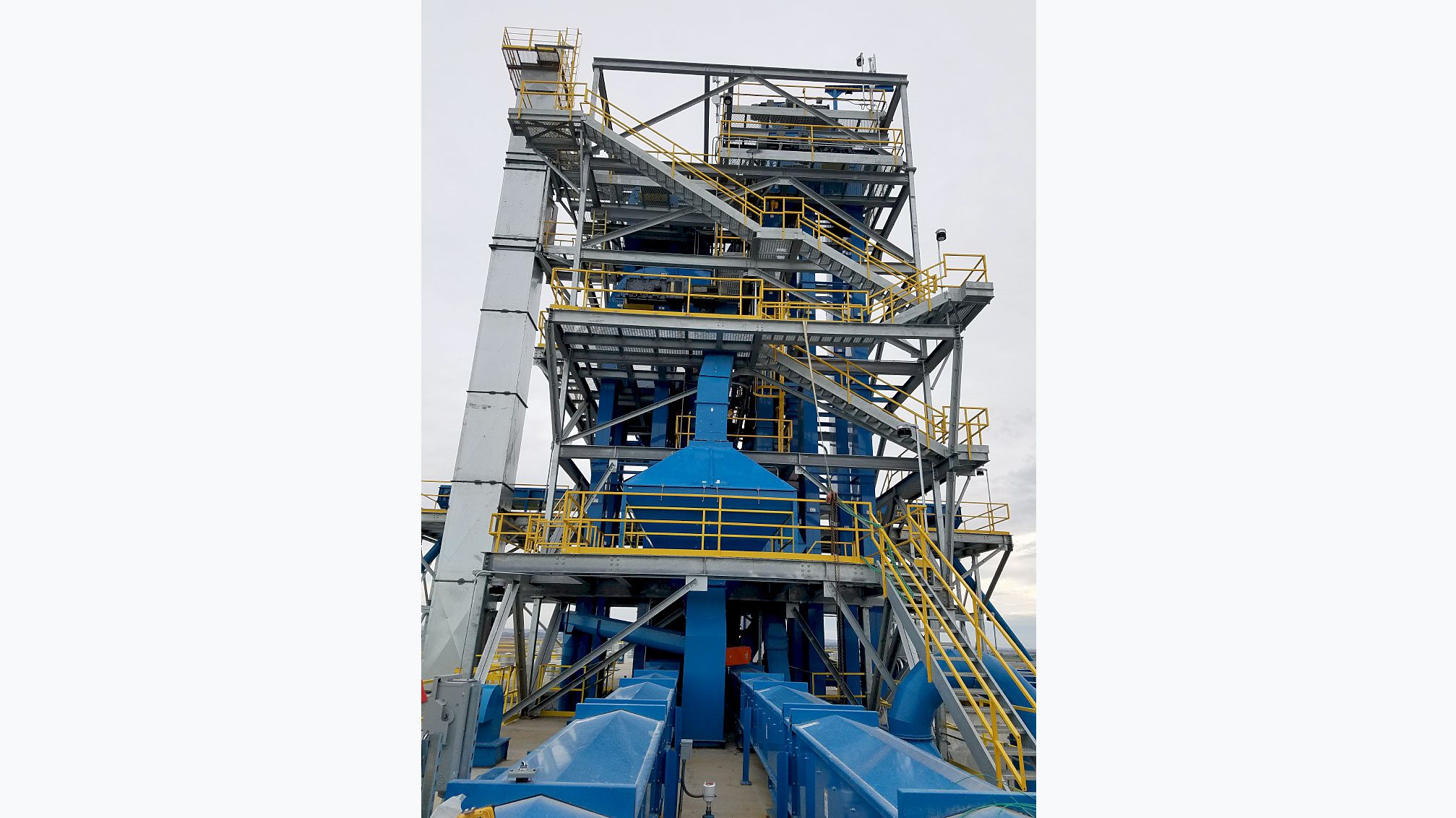 Blue machinery and yellow railings