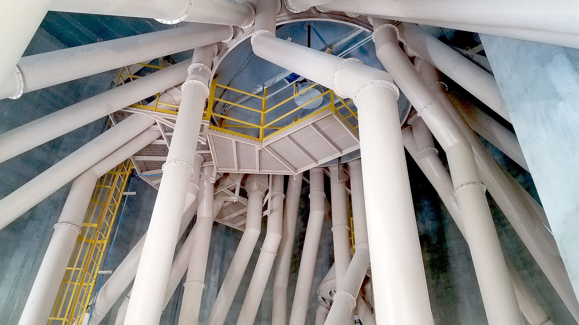 Industrial pipes and walkways inside a building