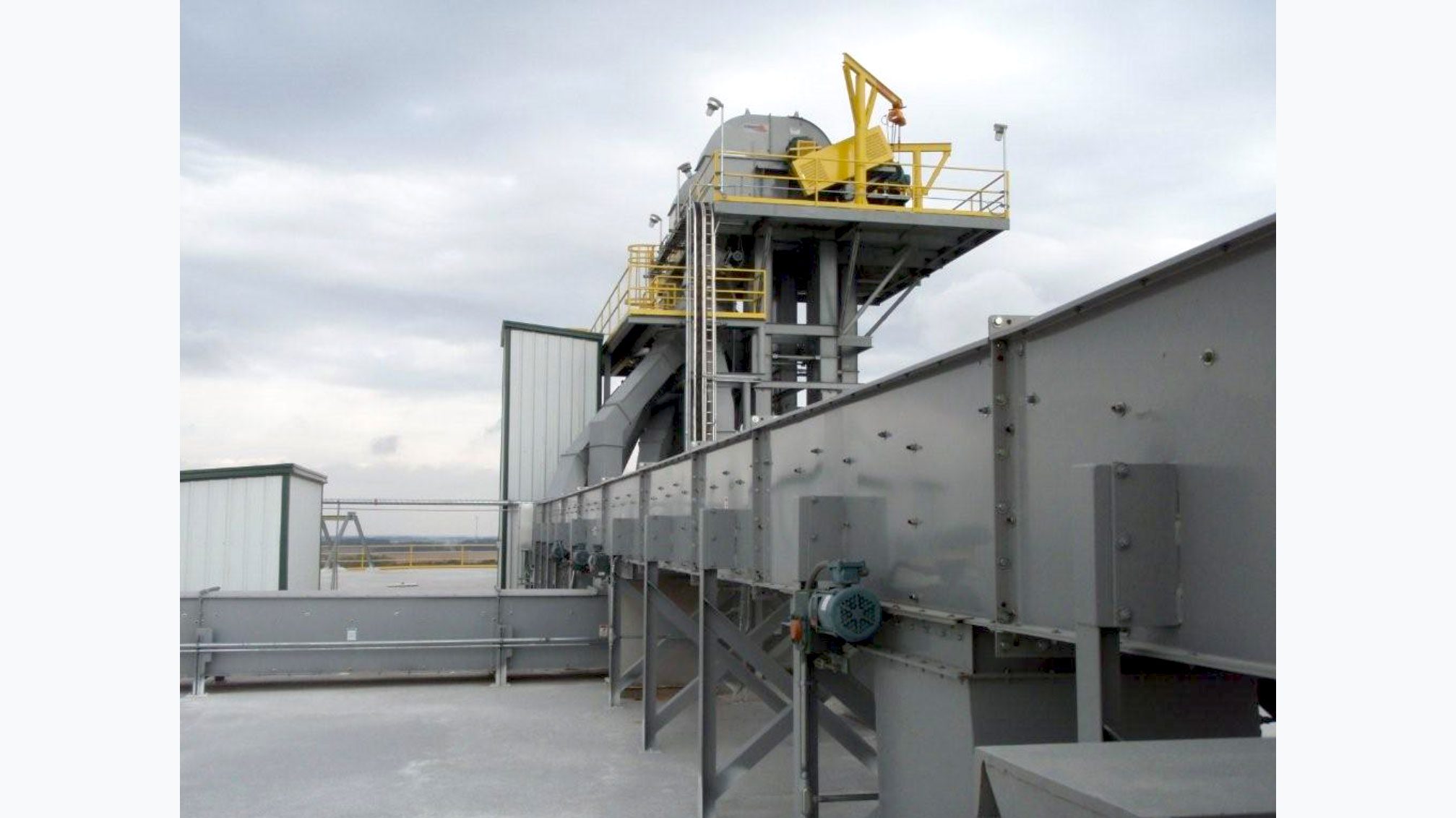 Factory conveyor with safety railings
