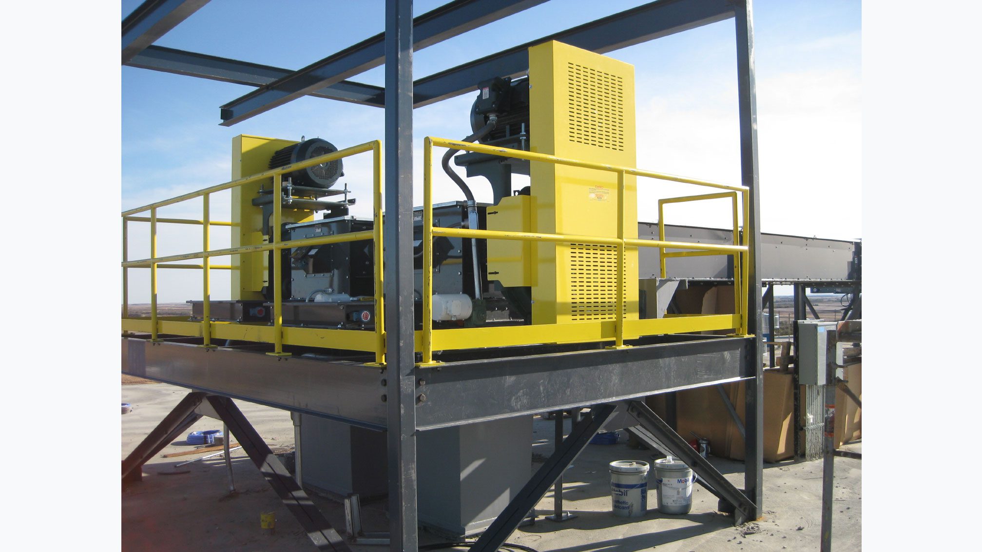 Yellow equipment on metal structure