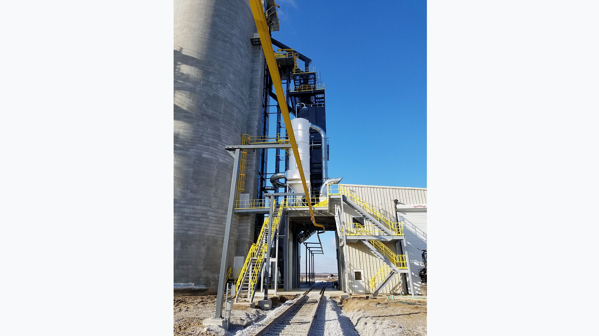 Yellow stairs and industrial structures